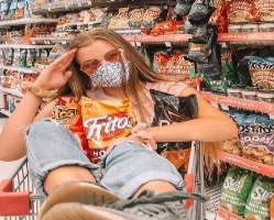 She enjoys shopping and much on Fritos She enjoys shopping and much on Fritos.